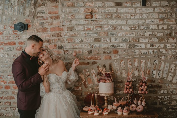 Bridal couple and sweets table
