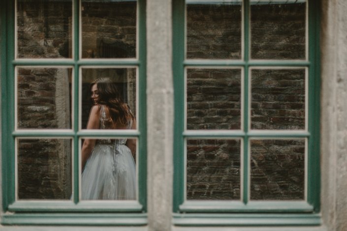 Bride reflection in window