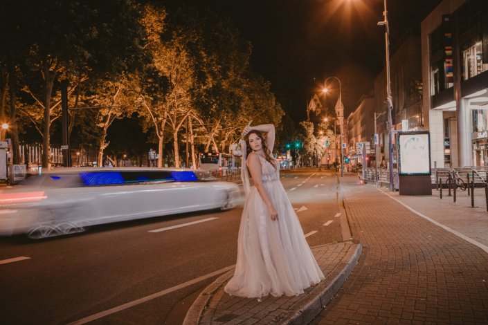 Bride with limousine in Cologne